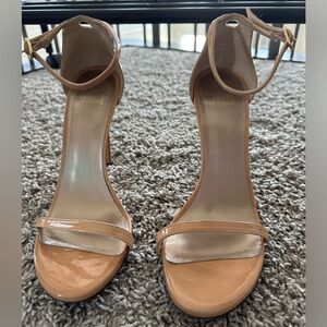 STUART WEITZMAN
NudistSong patent-leather sandals